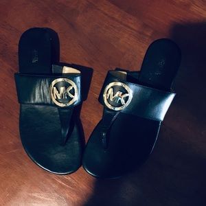 Classy Michael Kors black and gold metal sandals